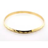 14ct yellow gold faceted bangle