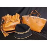 Two ladies handbags and a makeup purse