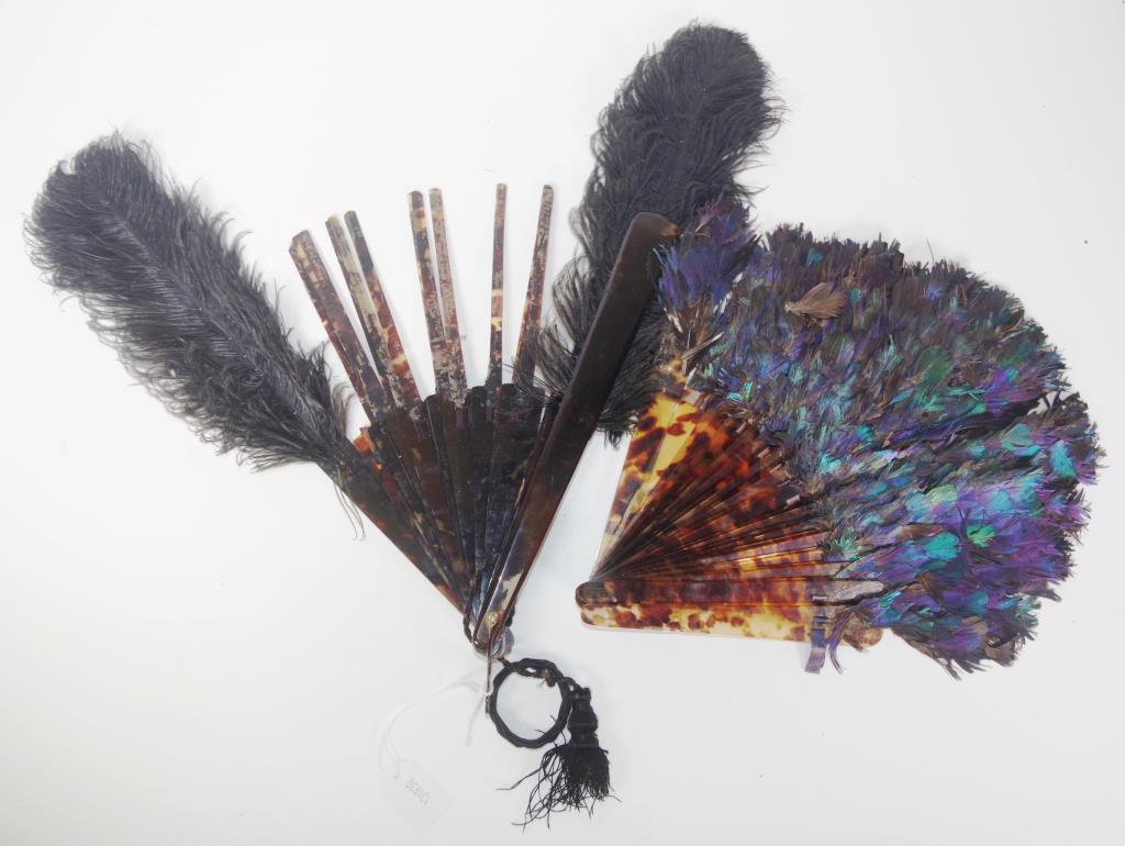 Two antique tortoiseshell fans with feathers