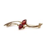 Garnet and 9ct yellow gold brooch