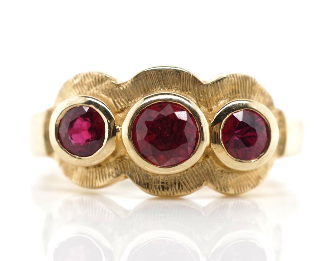 Ruby set 9ct rose gold trilogy ring