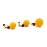 Egg yolk amber and gold earring and pendant set