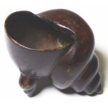 Early shell form bronze paperweight