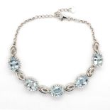 Aquamarine set silver halo bracelet