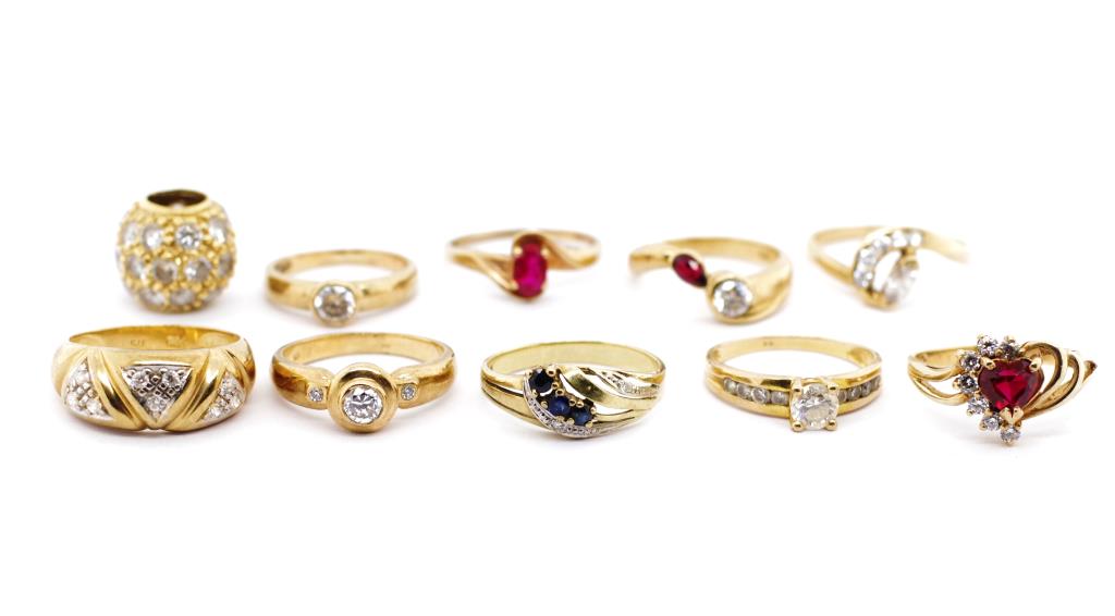 Nine gemstone set 9ct yellow gold rings