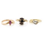 Three gemstone set 9ct yellow gold rings