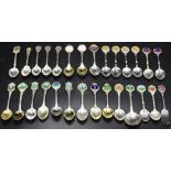 Collection of various golfing souvenir spoons