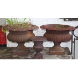 Three cast iron garden urns