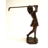 Carved timber lady golfing figure