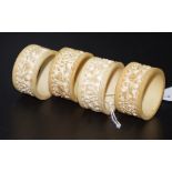 Four Chinese carved ivory napkin rings