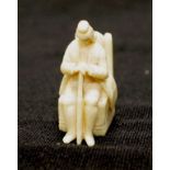 Antique ivory miniature seated gentleman figure