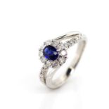 Sapphire, diamond and platinum halo ring