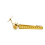 A yellow gold tie bar and diamond set tie tack