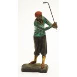 Cast metal figure of a gentleman golfer