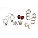 Five pairs of silver earrings