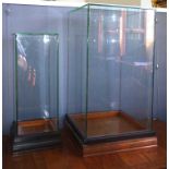 Two square glass display cases