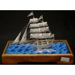Cased silver filigree model of boat