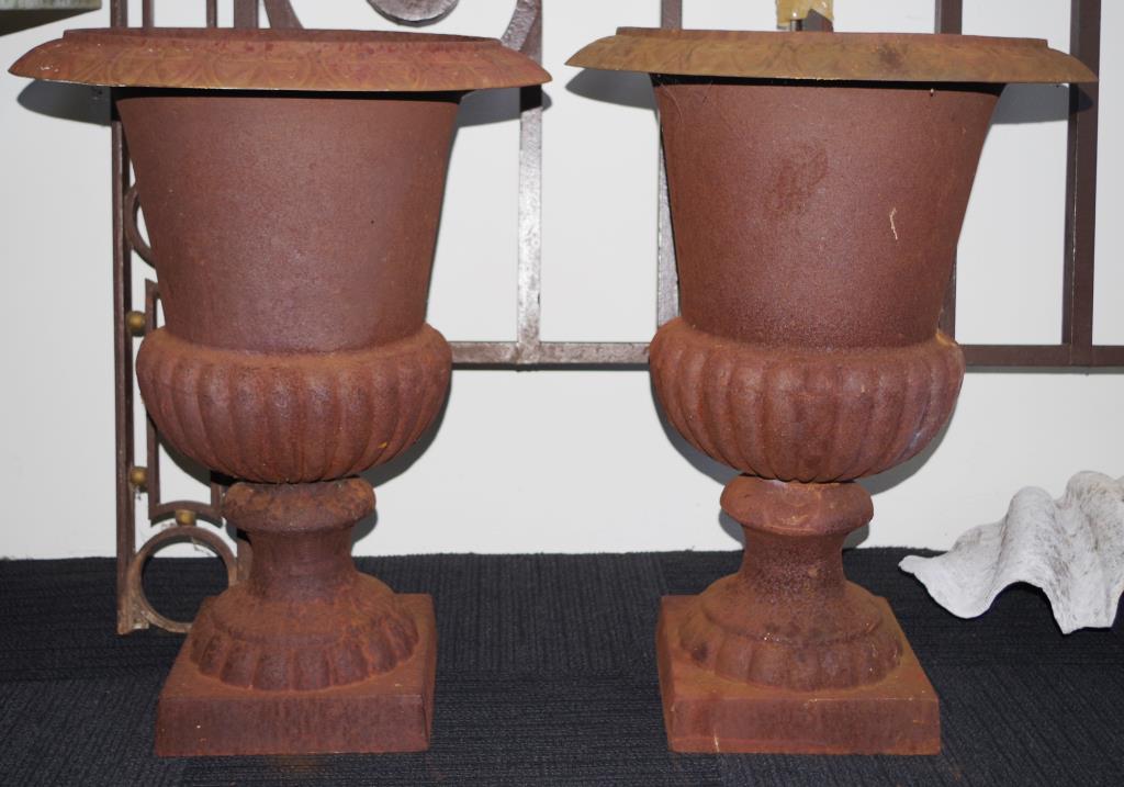 Two cast iron garden urns