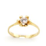 Solitaire white gemstone and gold ring