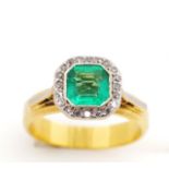 Emerald and diamond set yellow gold ring