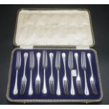 Cased set twelve silver plate cake forks