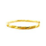 Oriental yellow gold bangle