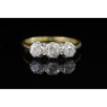 Three stone diamond, platinum and 18ct gold ring