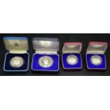 Four commemorative silver proof coins