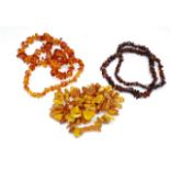 Two amber beaded necklaces and a faux example
