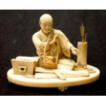 Meiji Japanese carved ivory seated Fletcher figure