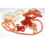 Ten coral beaded necklaces