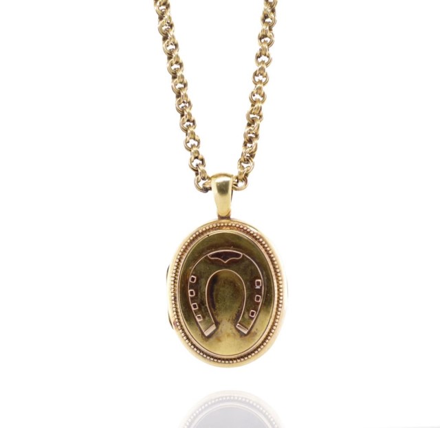 Antique yellow gold horse shoe locket and chain