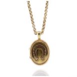 Antique yellow gold horse shoe locket and chain