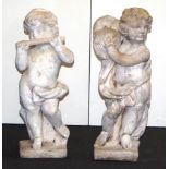 Two concrete cherub musician garden figurines