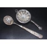 Two various antique sterling silver tea strainers