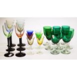 Eight antique green coloured wine glasses