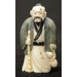 Early carved Ivory sage holding a stick netsuke