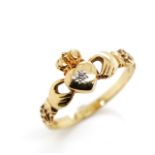 Diamond and yellow gold claddagh ring