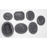 Seven antique Wedgwood black basalt intaglio seals
