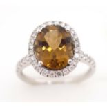 Tourmaline and diamond 18ct white gold halo ring