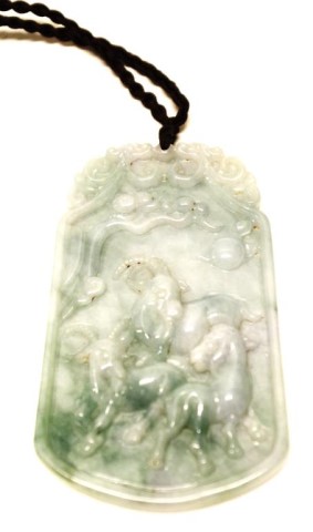 Chinese carved jade tablet decorated with goats