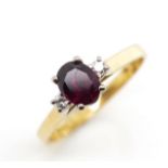 0.85ct Ruby and diamond set 18ct gold ring