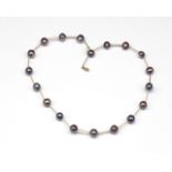 Black pearl and 14ct yellow gold choker necklace