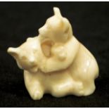 Early carved marine ivory two bears figure