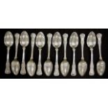 Twelve George IV sterling silver dessert spoons