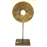 Chinese hardstone disk on a metal stand