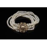Five strand pearl and 9ct yellow gold bracelet