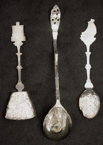 Three Dutch silver decorative serving spoons