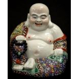 Chinese enamelled seated Buddha ceramic figure