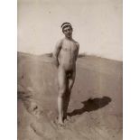 Gloeden, Wilhelm von: Nude youth on beachNude youth on beach. Circa 1900. Albumen print. 22,2 x 16,8